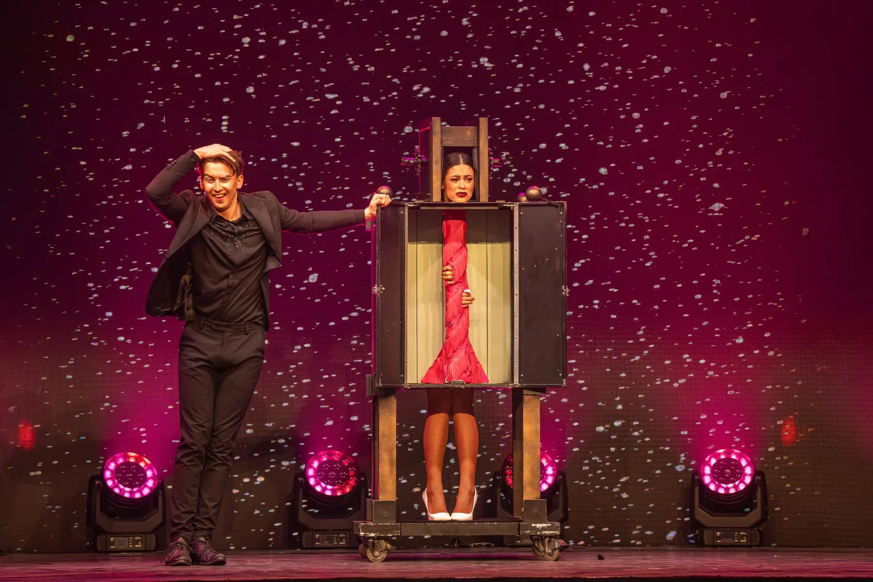 Nigel Otermans performing a box illusion on stage